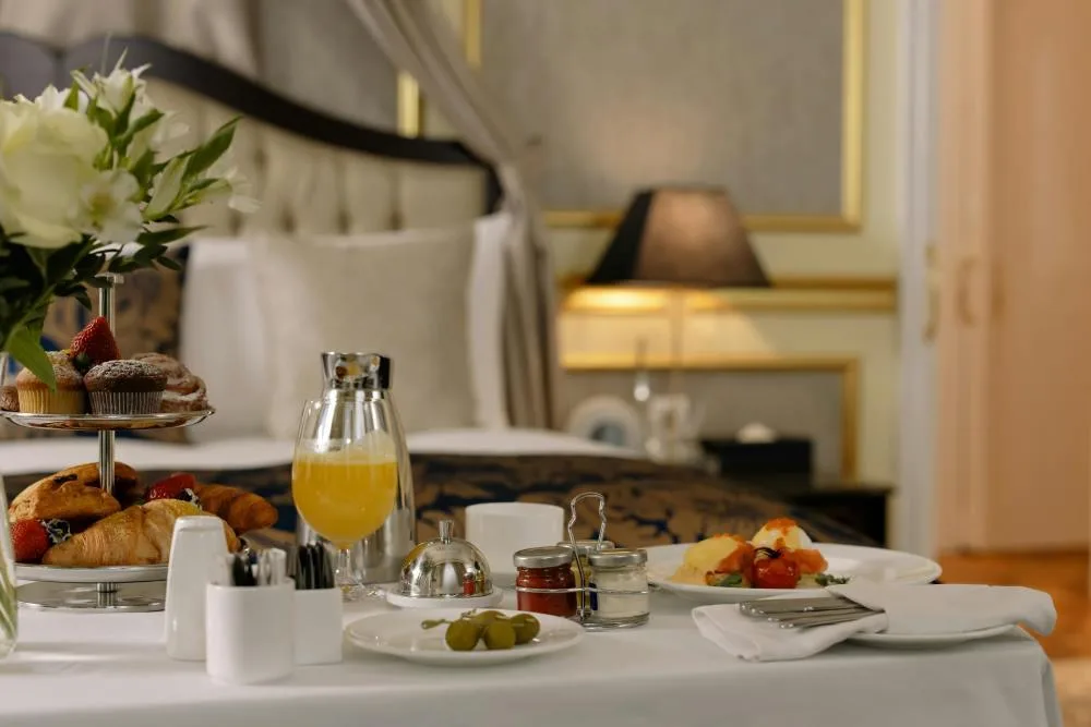 Gourmet room service breakfast in a luxury hotel suite.